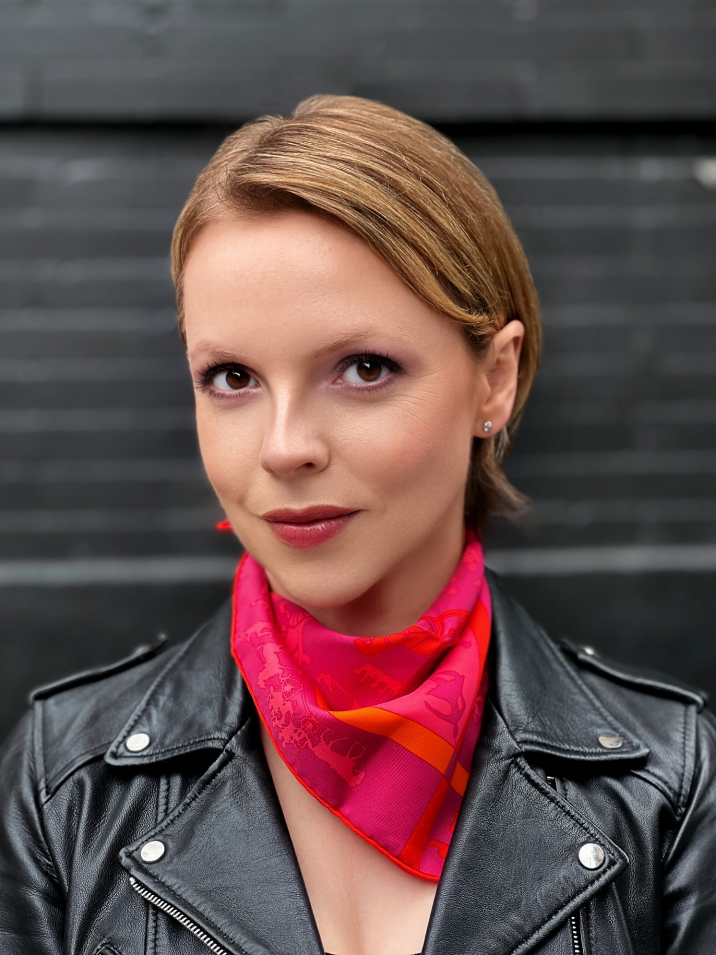 Professor Stern-Baczewska in a black jacket and a pink and orange neckerchief.