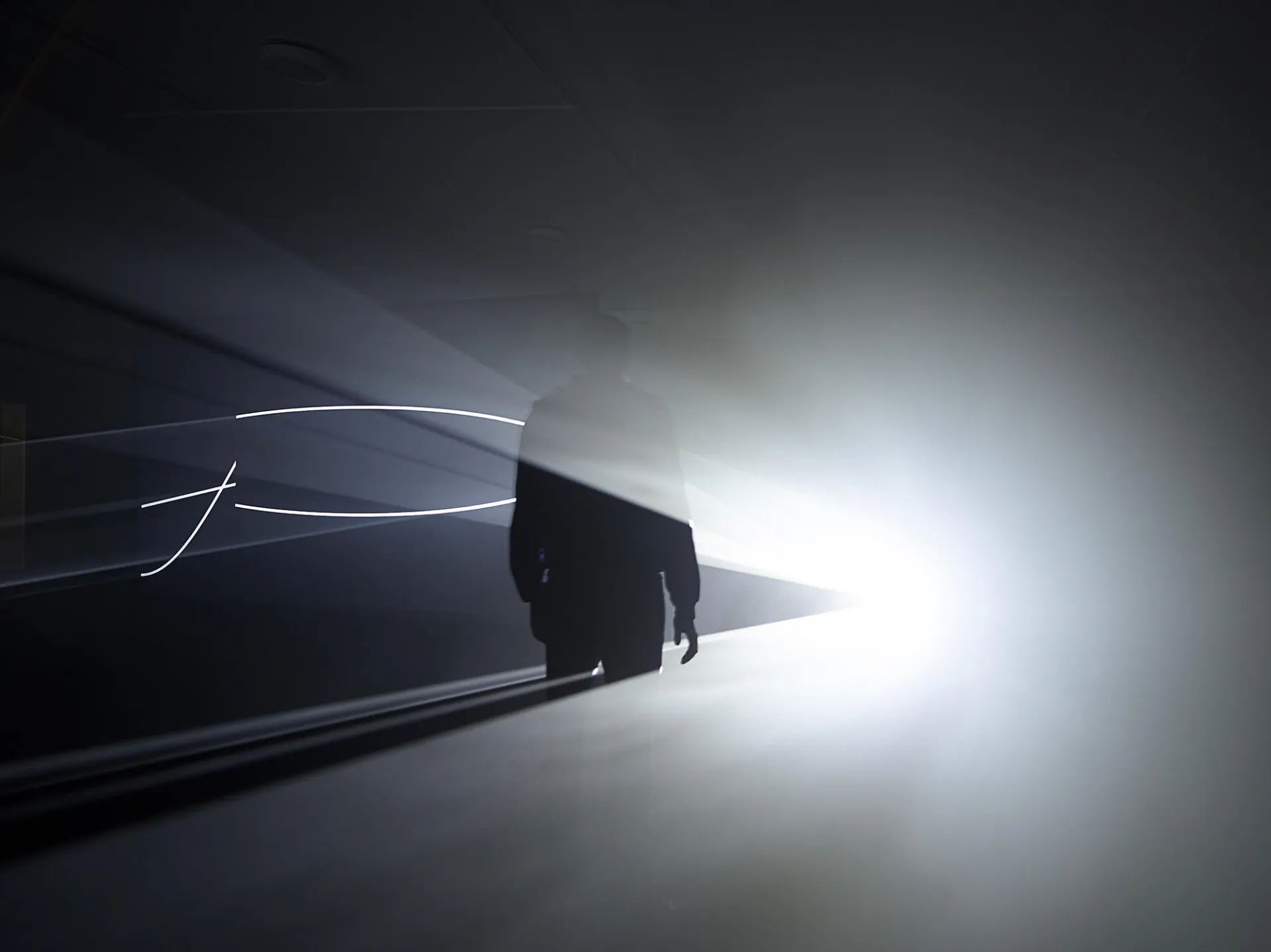 Picture of a man standing in front of a bright light