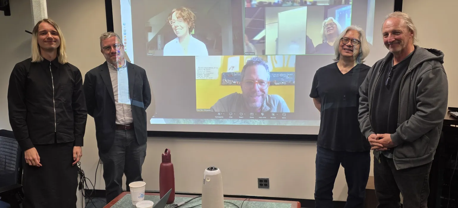 David Farrow with their committee. Catherine and Naor are attending via Zoom.