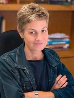Photo of Alejandra Bronfman. She has a short haircut and a jean jacket.